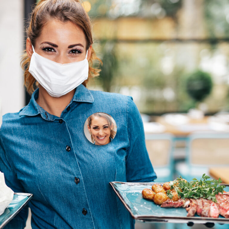 Face Photo Button on a Waitress Wearing a Mask