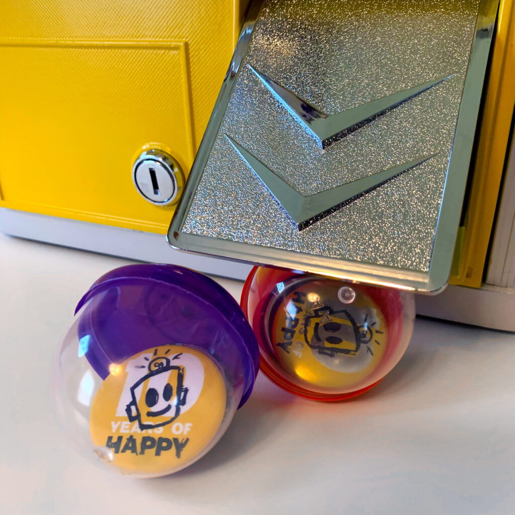 Closeup of HAPPY buttons in capsules